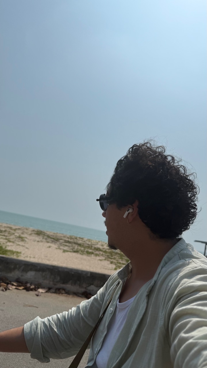 Kevin riding beside the coast