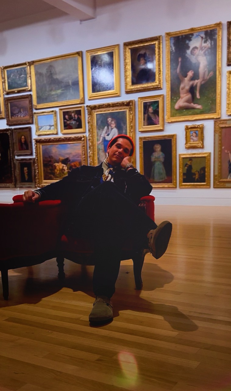Kevin seated in a museum gallery